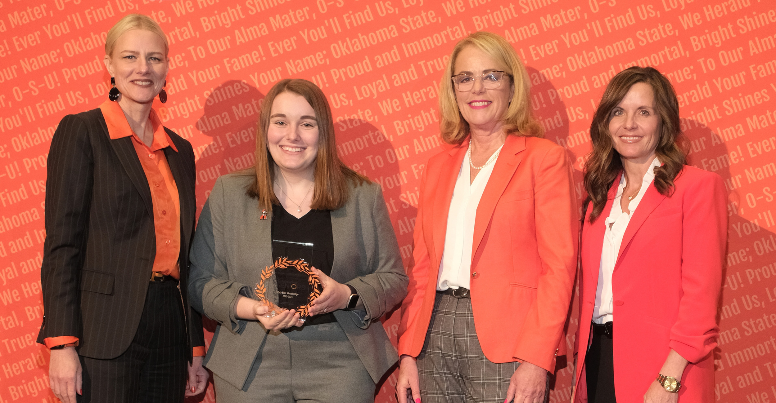 Kyla Ellis Woodbridge on stage with OSU president Dr. Kayse Shrum at the OSU Alumni Association Outstanding Seniors banquet.