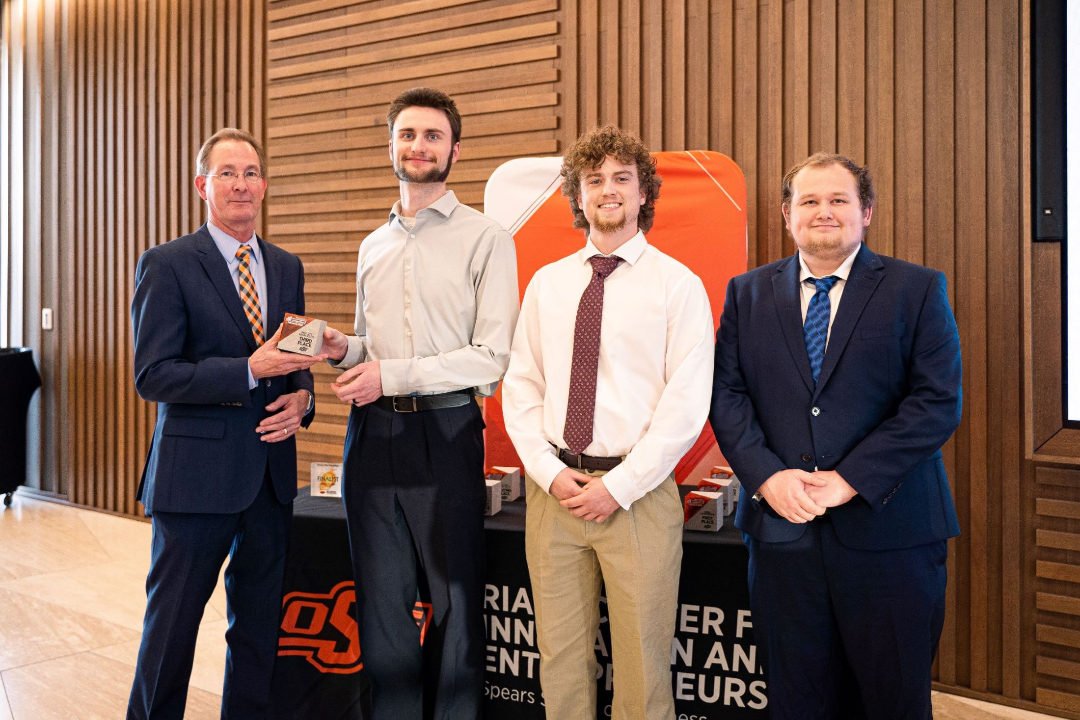 RSX student receiving award at Business Plan Competition