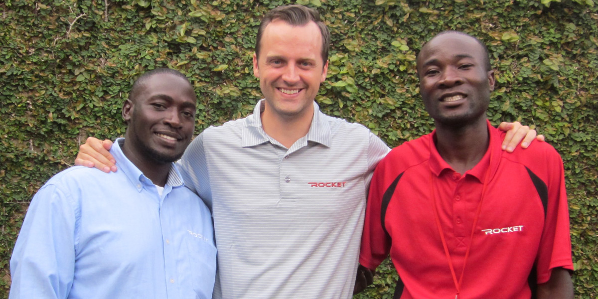 Tyler with two Ugandan colleagues