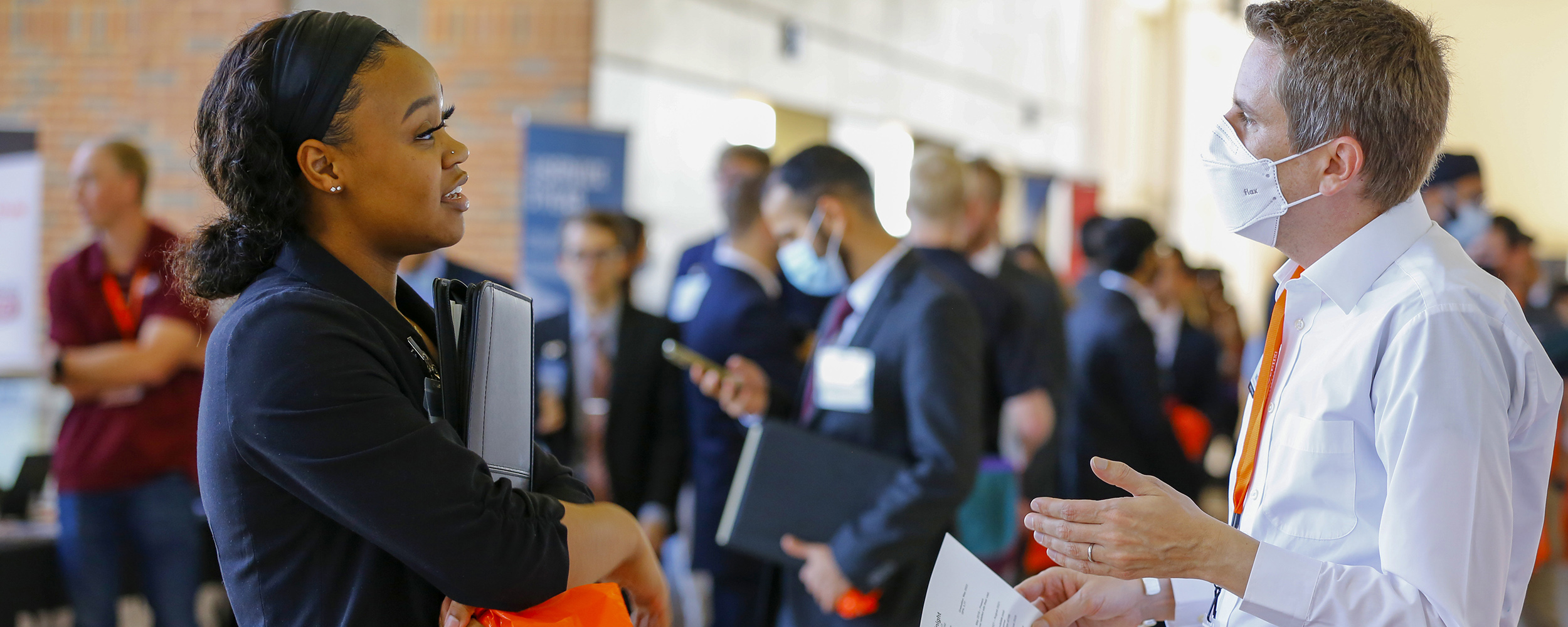 Students networking with recruiters at the career fair. Students networking with recruiters at the career fair.