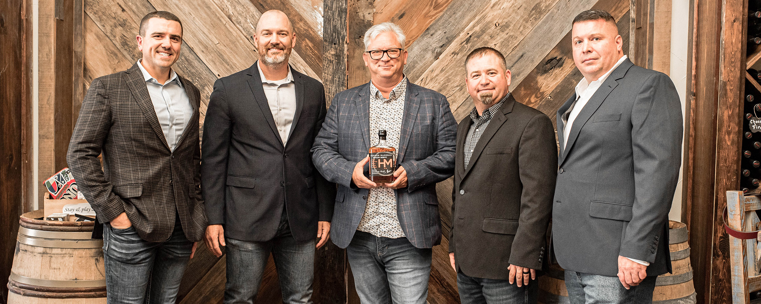 Ryan Hamar, left, and others with their whiskey. Ryan Hamar, left, and others with their whiskey.