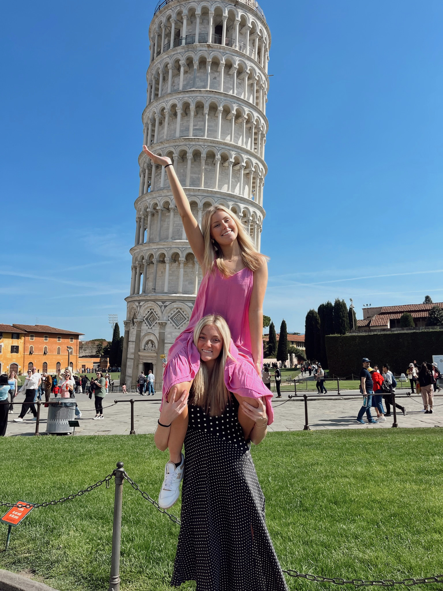 Two students at the leaning tower of Piza