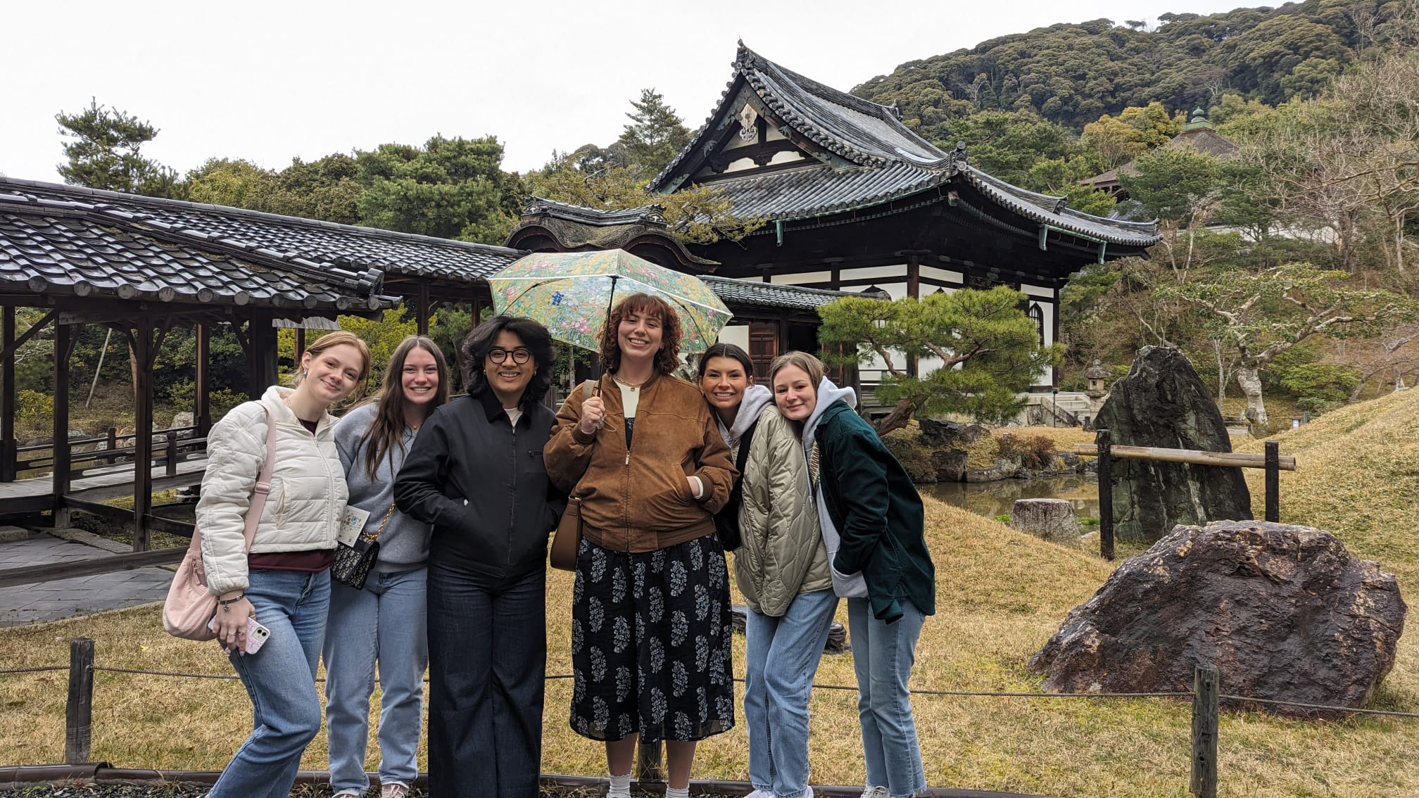 Students outside of traditional building in Japan