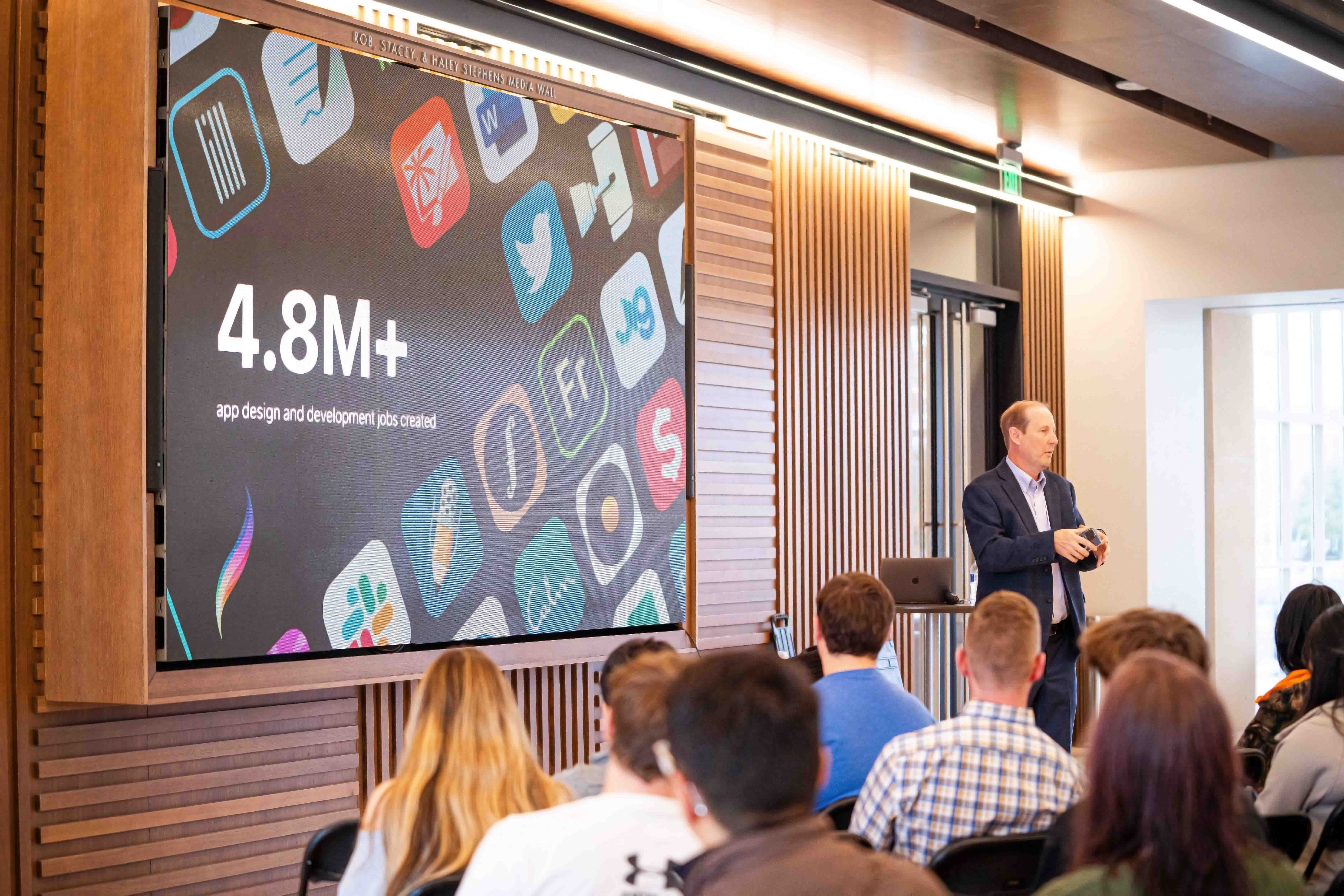 Industry professional speaking to students in the Keystone Lobby.