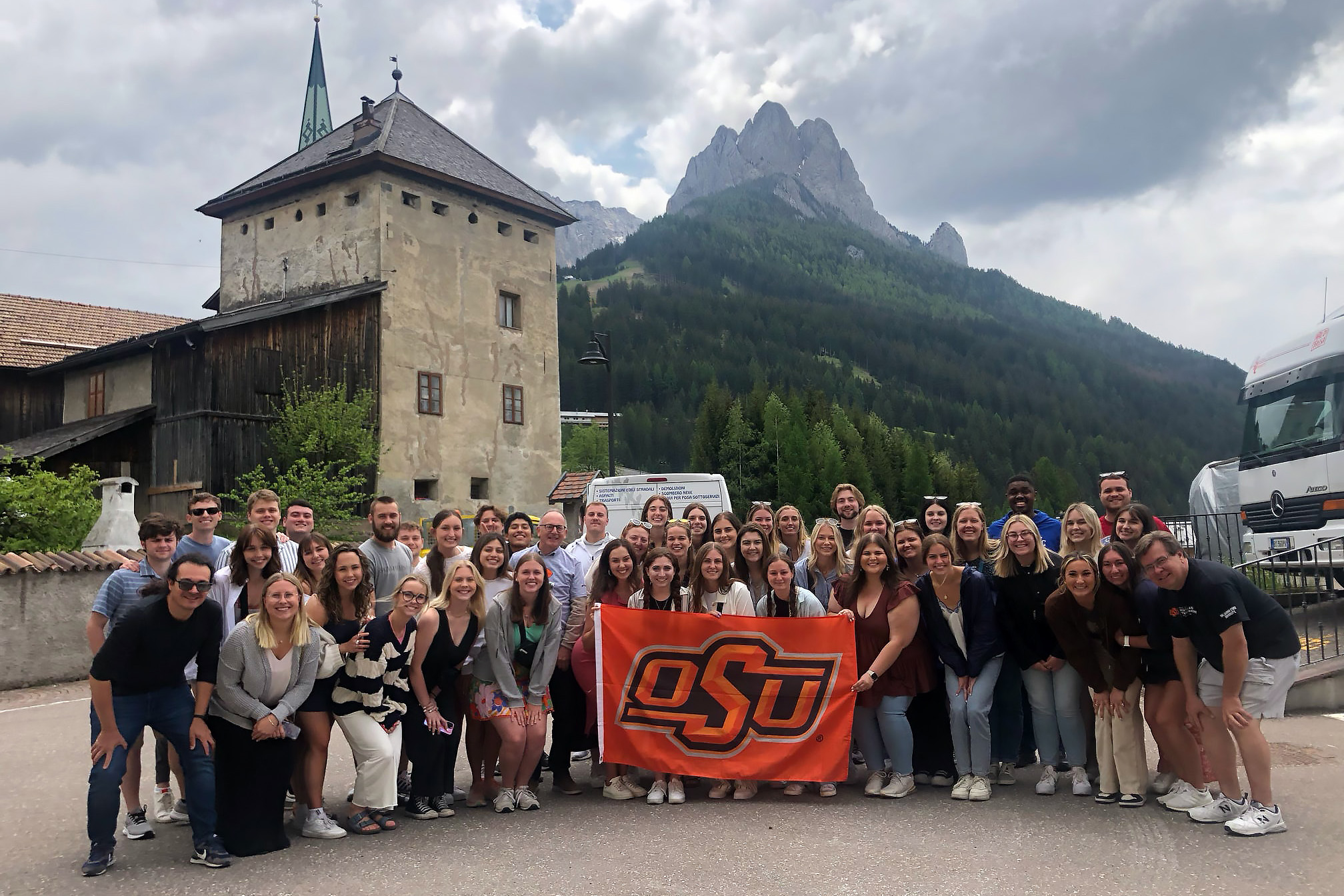 Large group of students in northern Italy, beautiful scenery and mountains in the background
