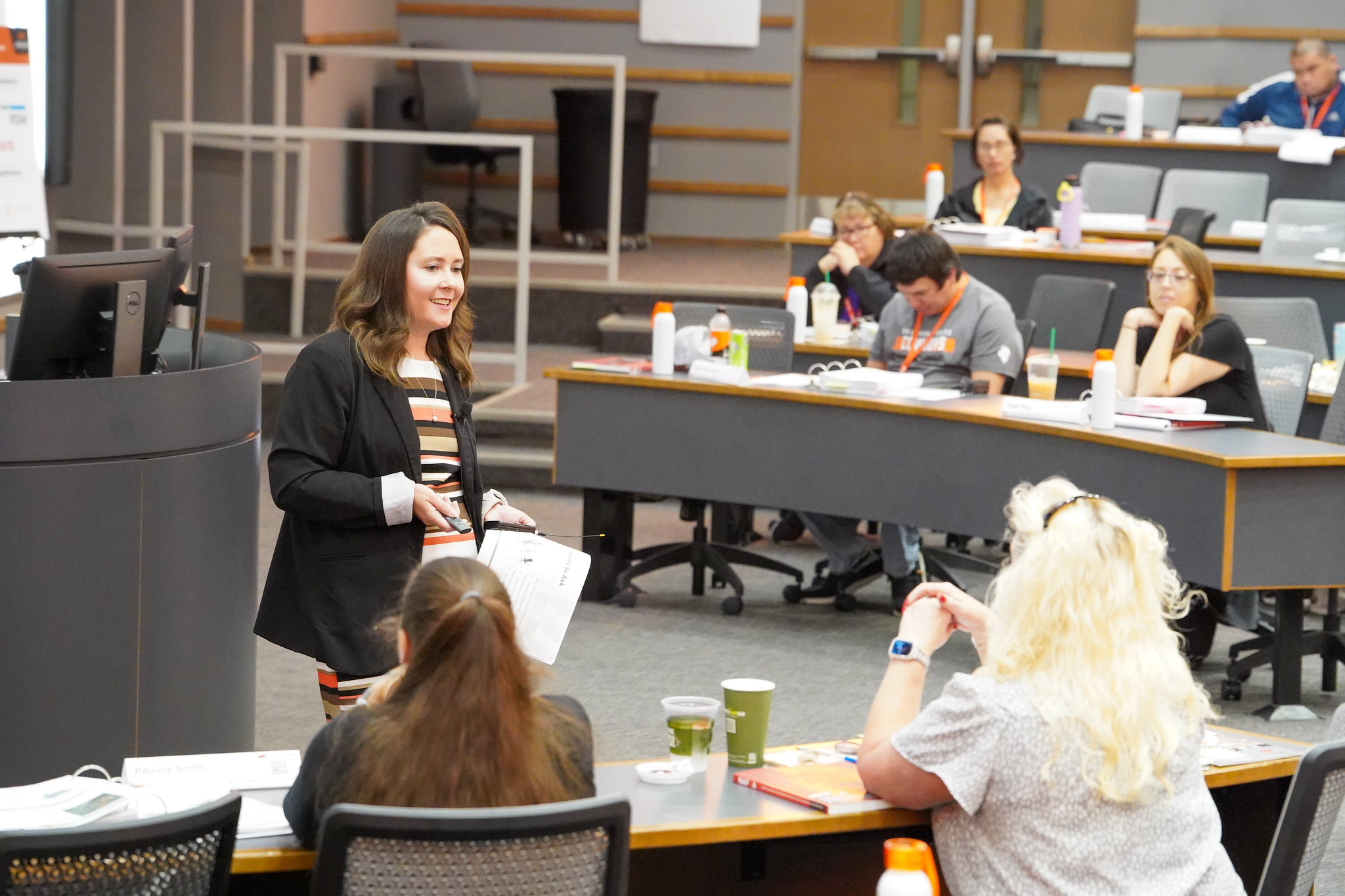 brunette woman speaking in front of a classroom of Tribal professionals