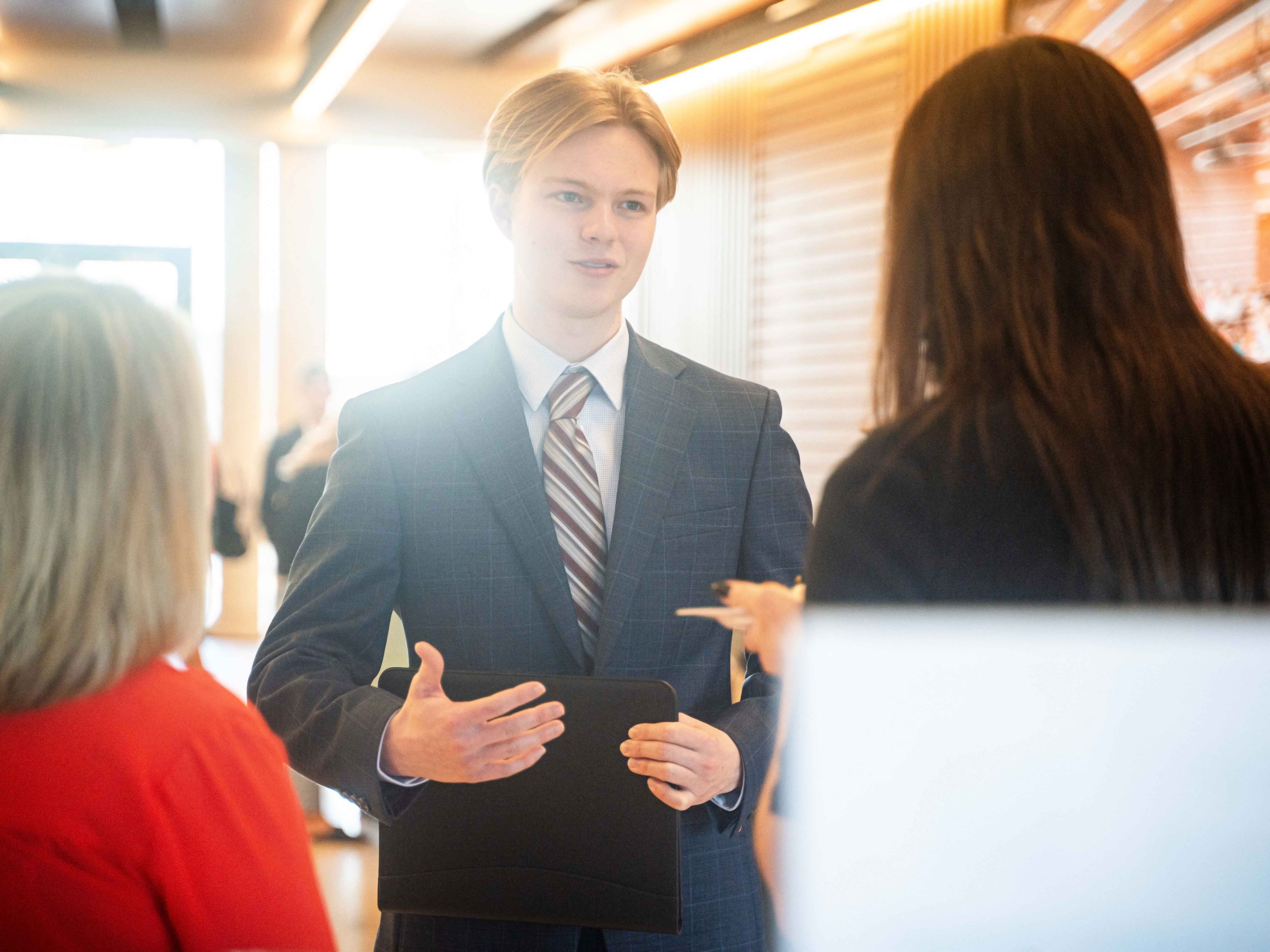 Student speaking with employers