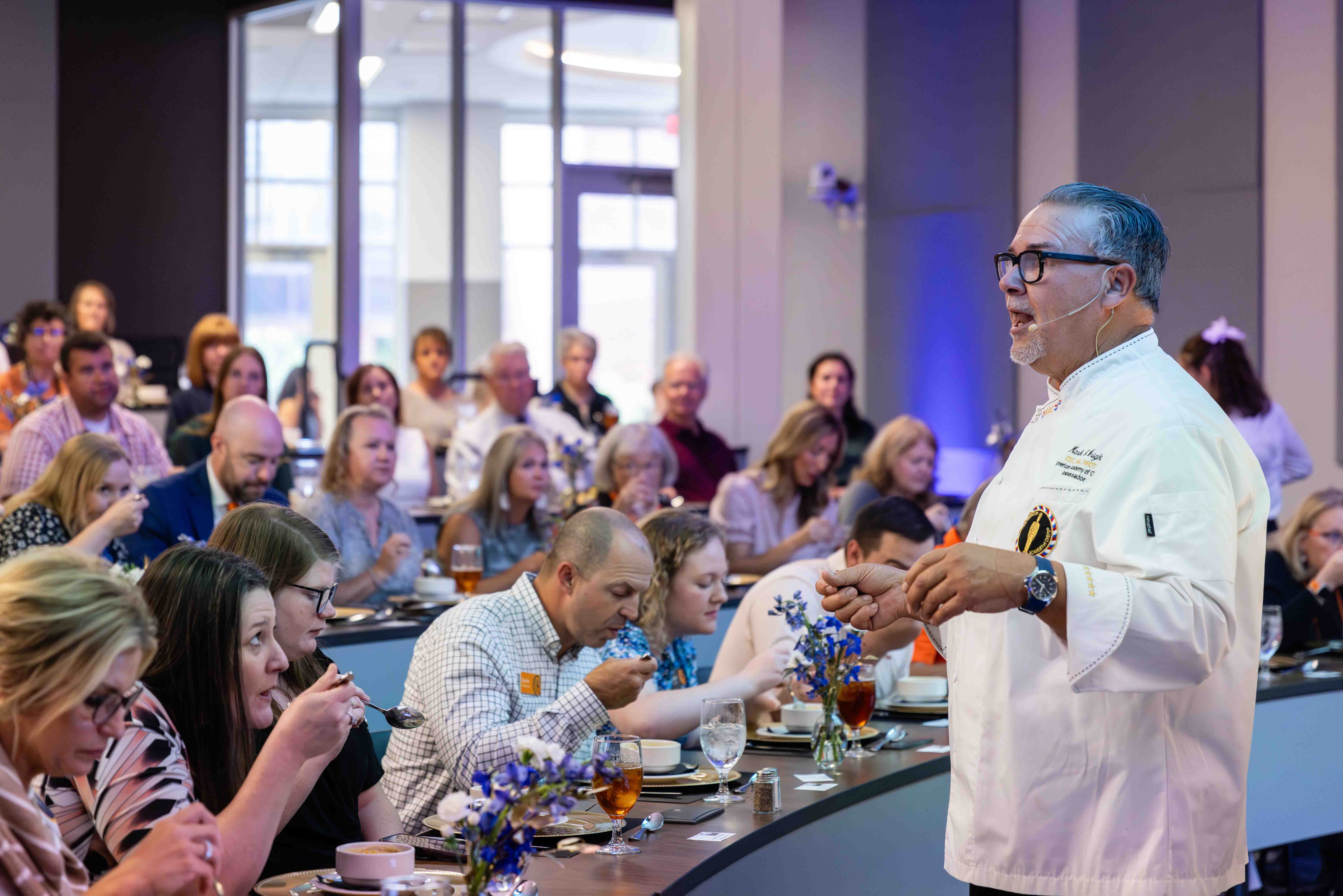 Chef Mark Wright speaking to guests in 2024