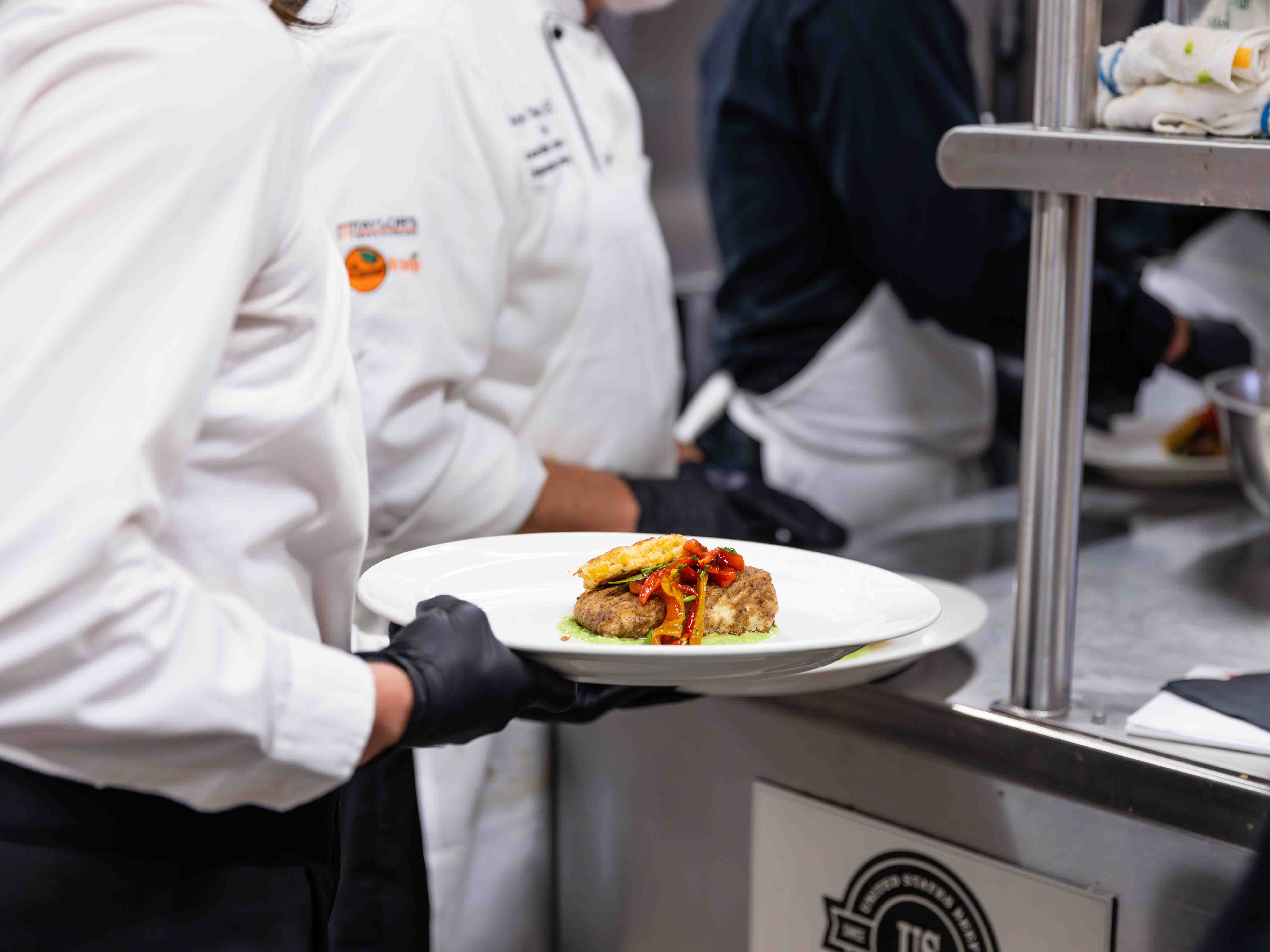 Student holding a plate of food