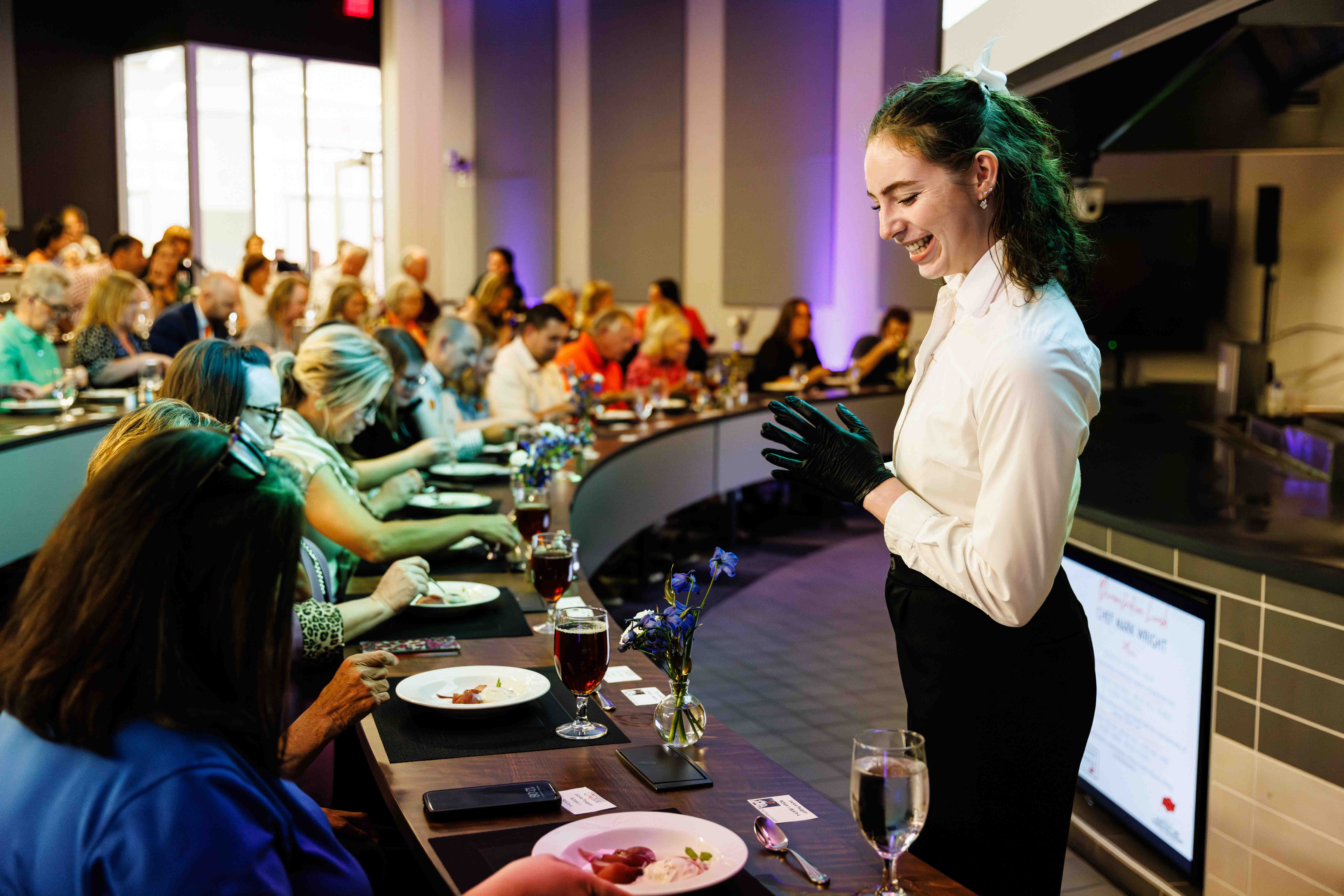 Student worker serving guests