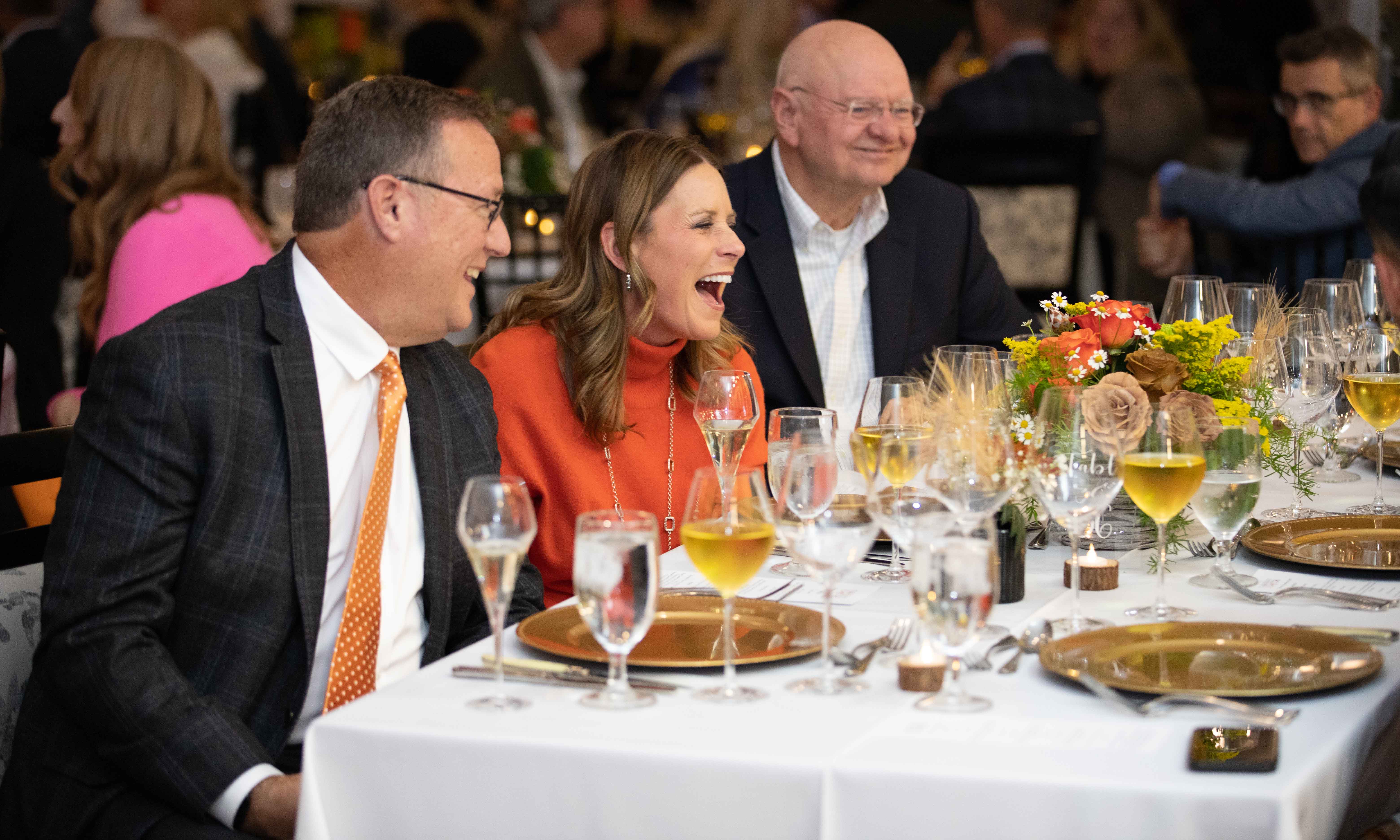 Guests laughing during the chef event.