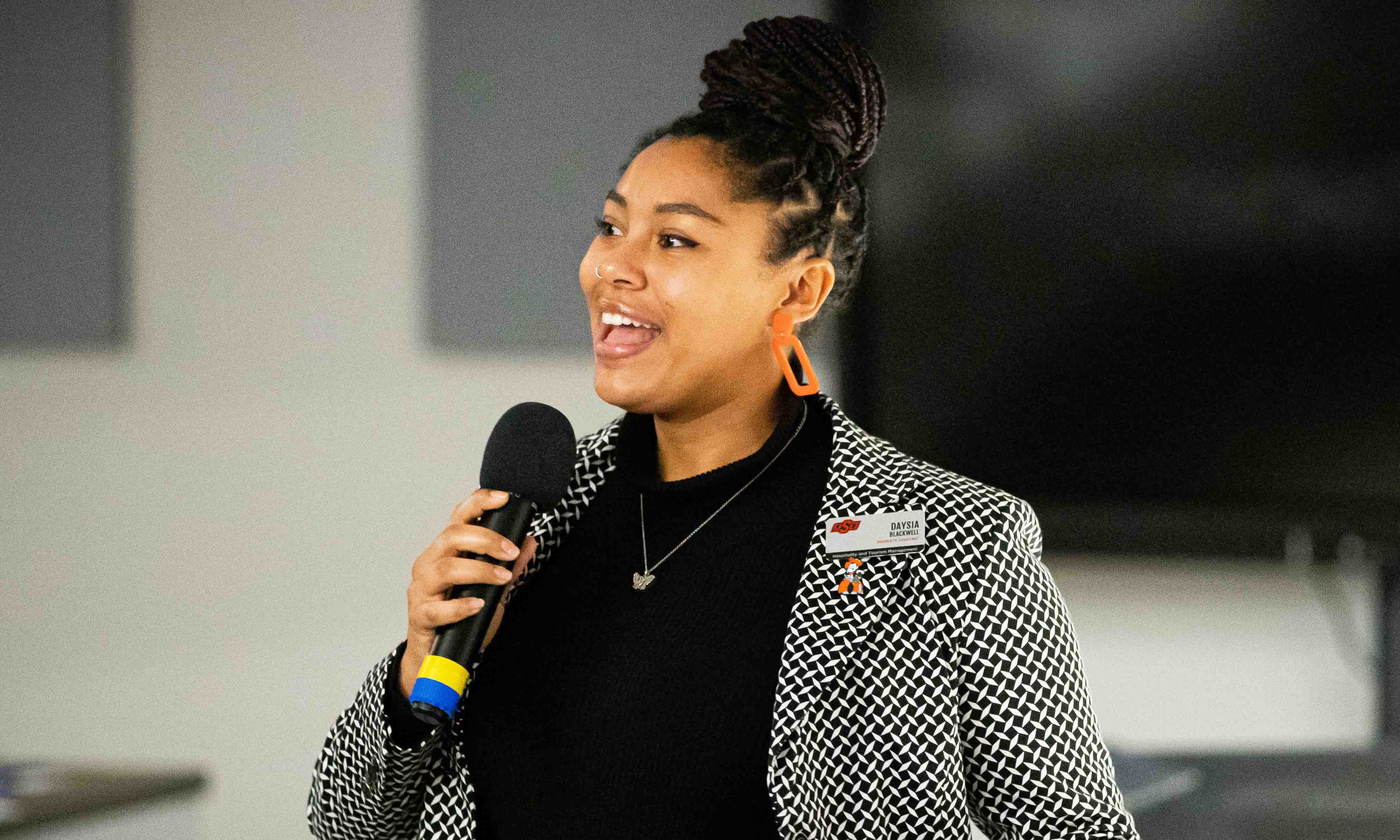 Student speaking with guests.