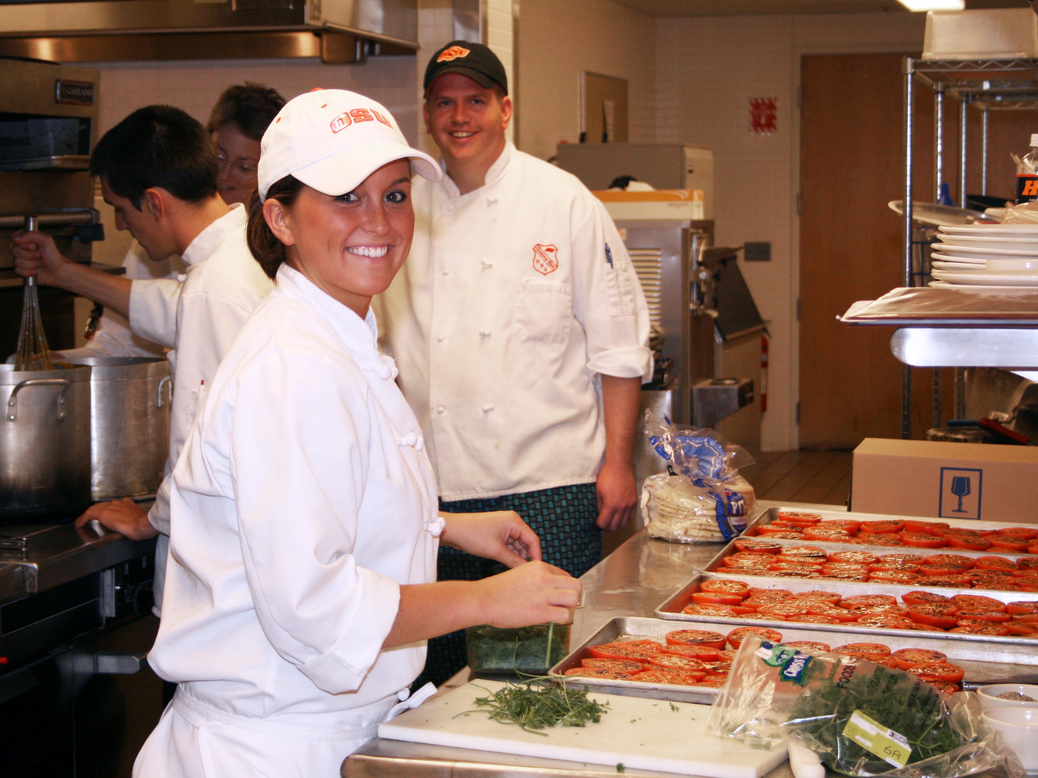 Student preparing a meal for a HTM event in 2007