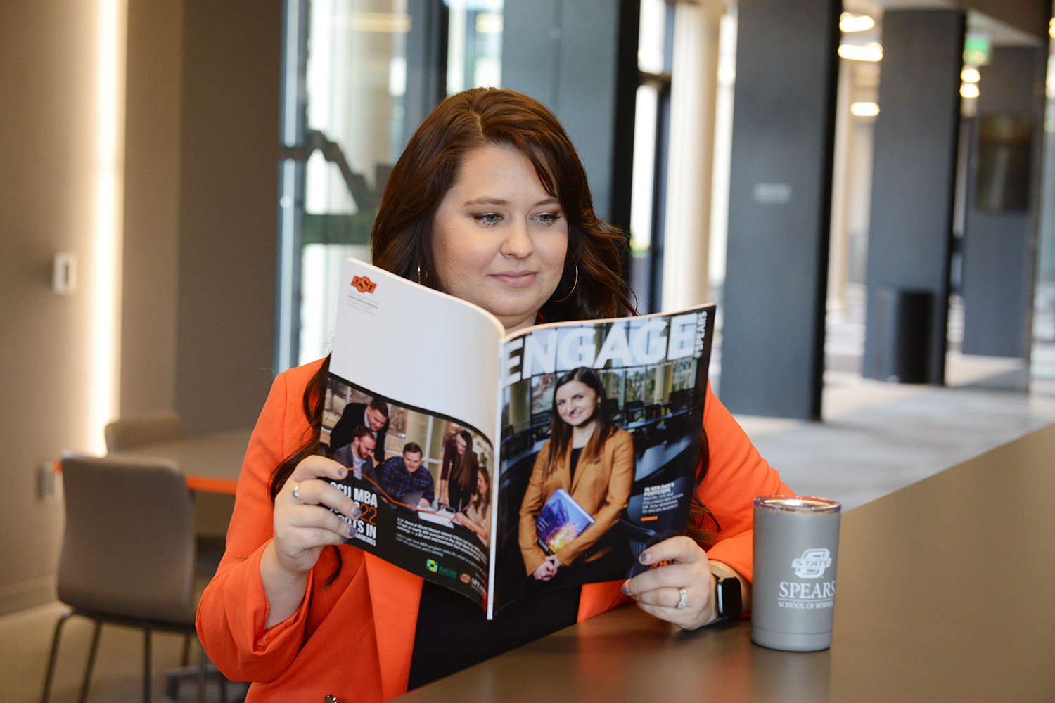 Young professional reading magazine.