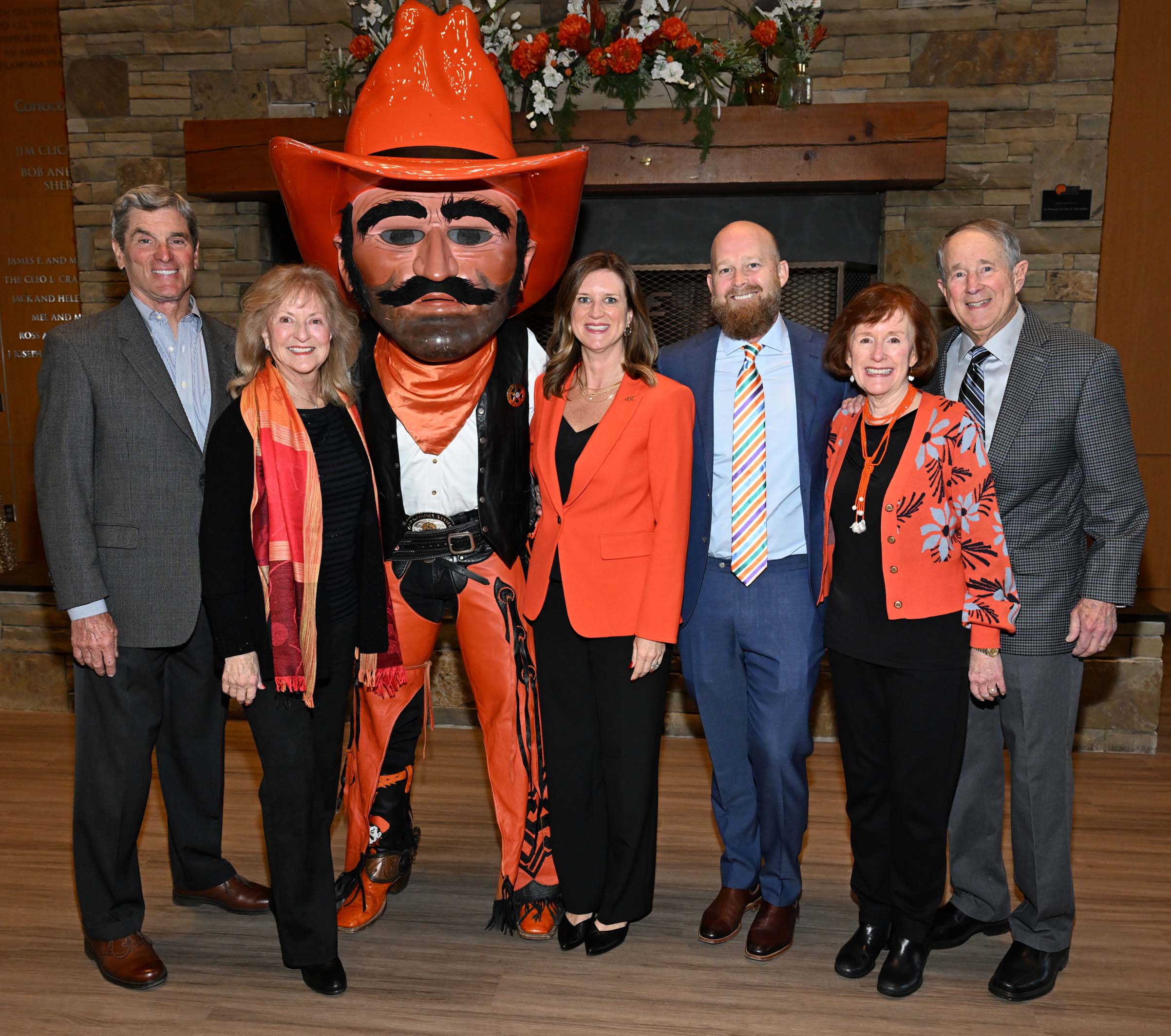 Alumni and family standing with Pistol Pete