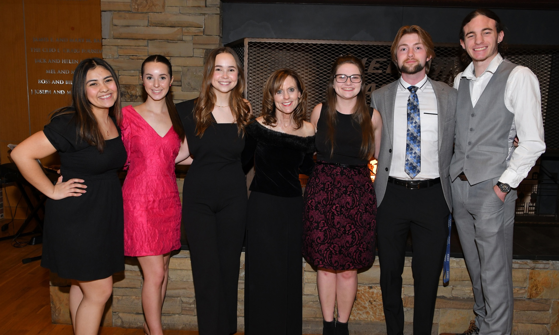 Professor Strom smiling with students