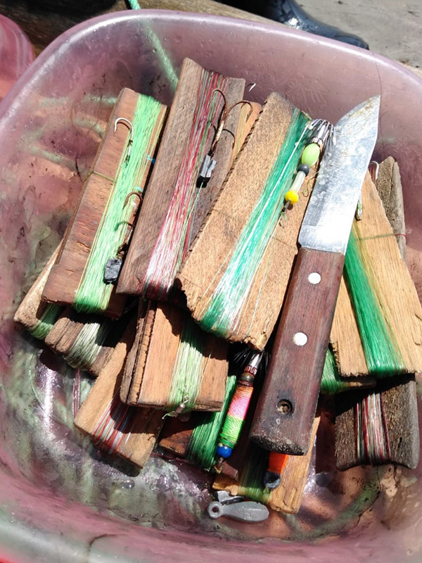 Wood beams inside a bucket.
