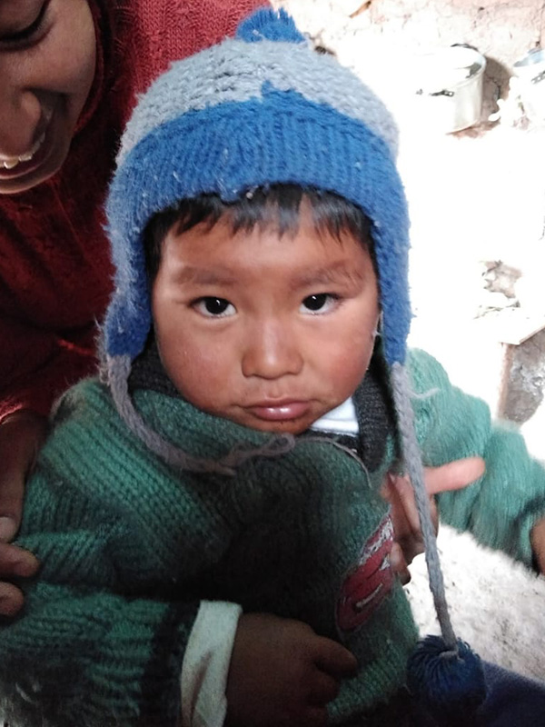 Child wearing winter clothes.