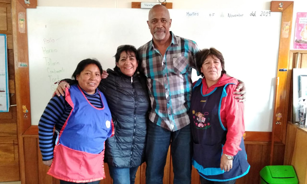Group of four inside a building.