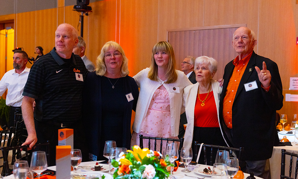 Cowboy100 winners sing the OSU alma mater arm in arm