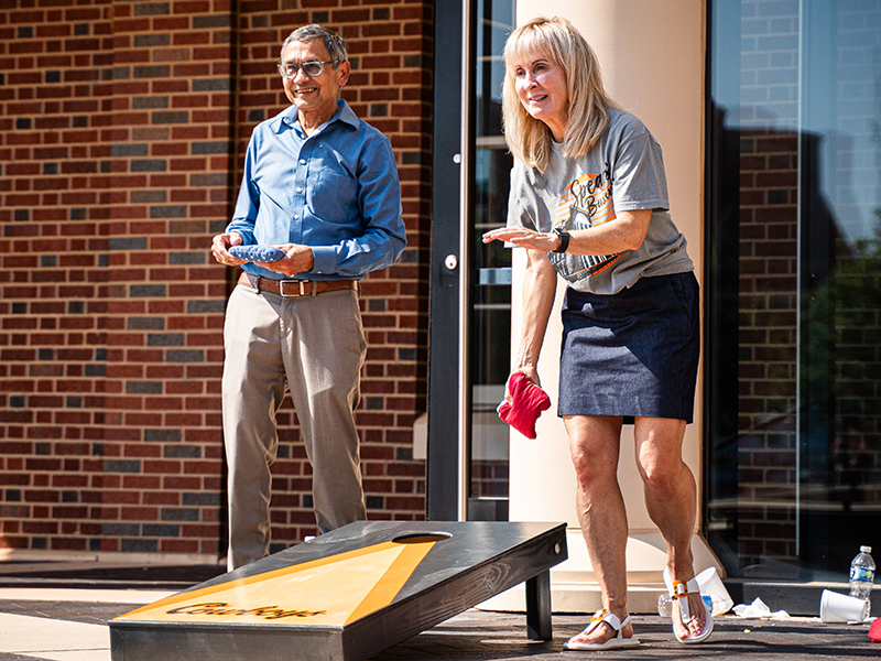 Dr. Sharda Dr. Sharda plays cornhole with Teresa Lightner at a Spears event.